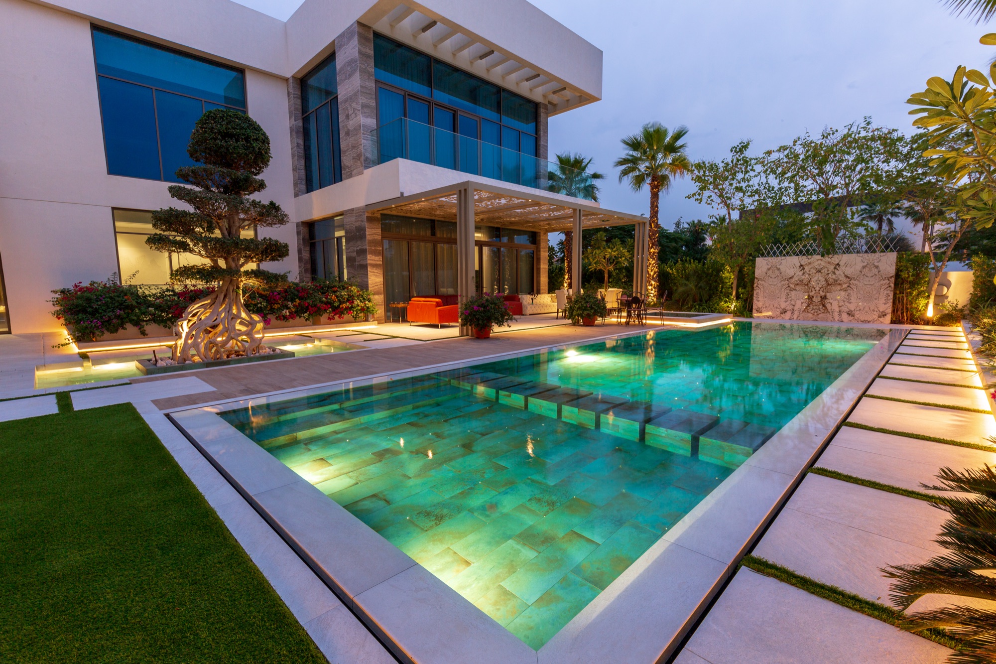 Pool, decorative pergola and landscaped villa garden