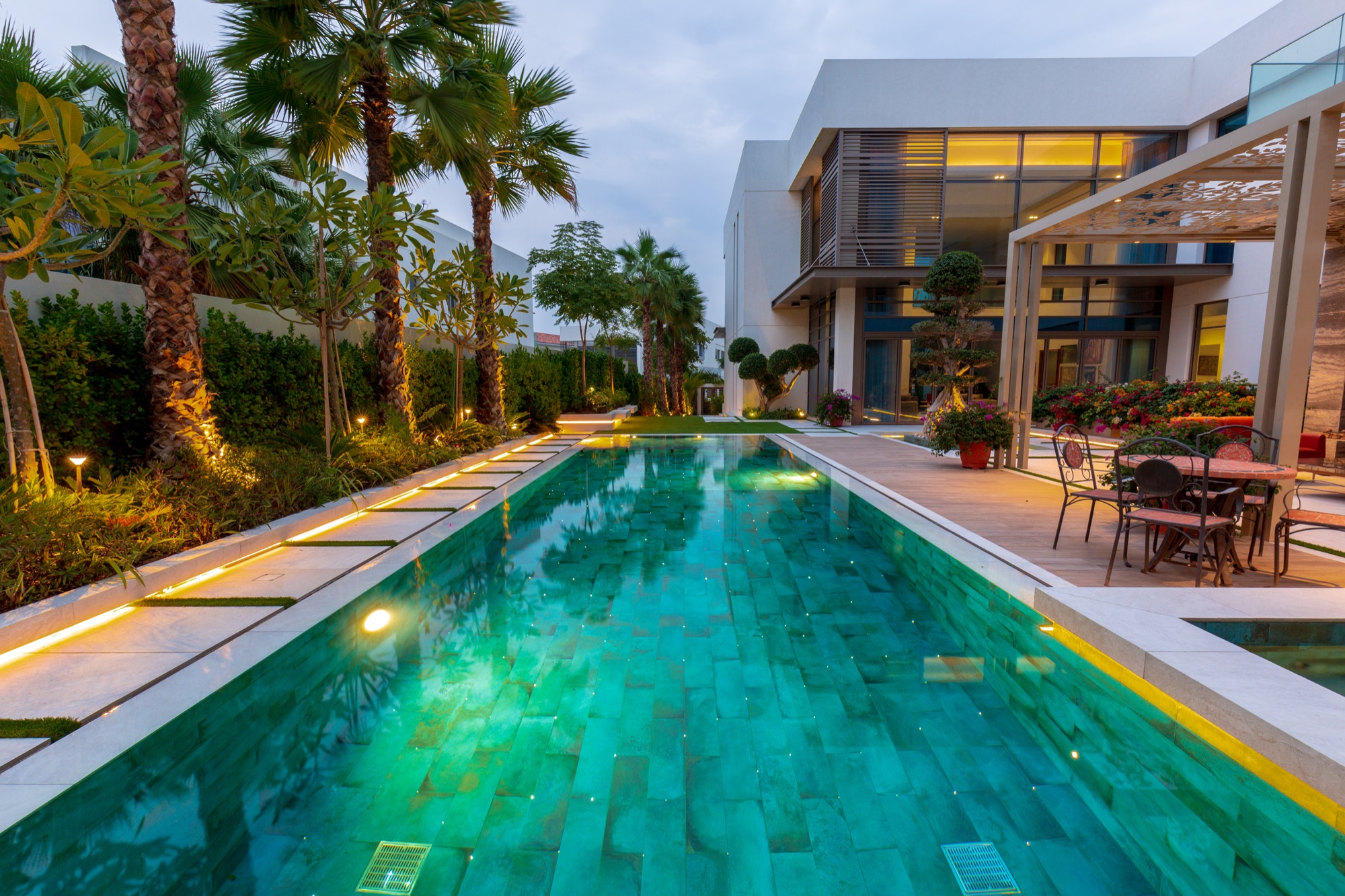 Pergola overlooking a landscaped swimming pool