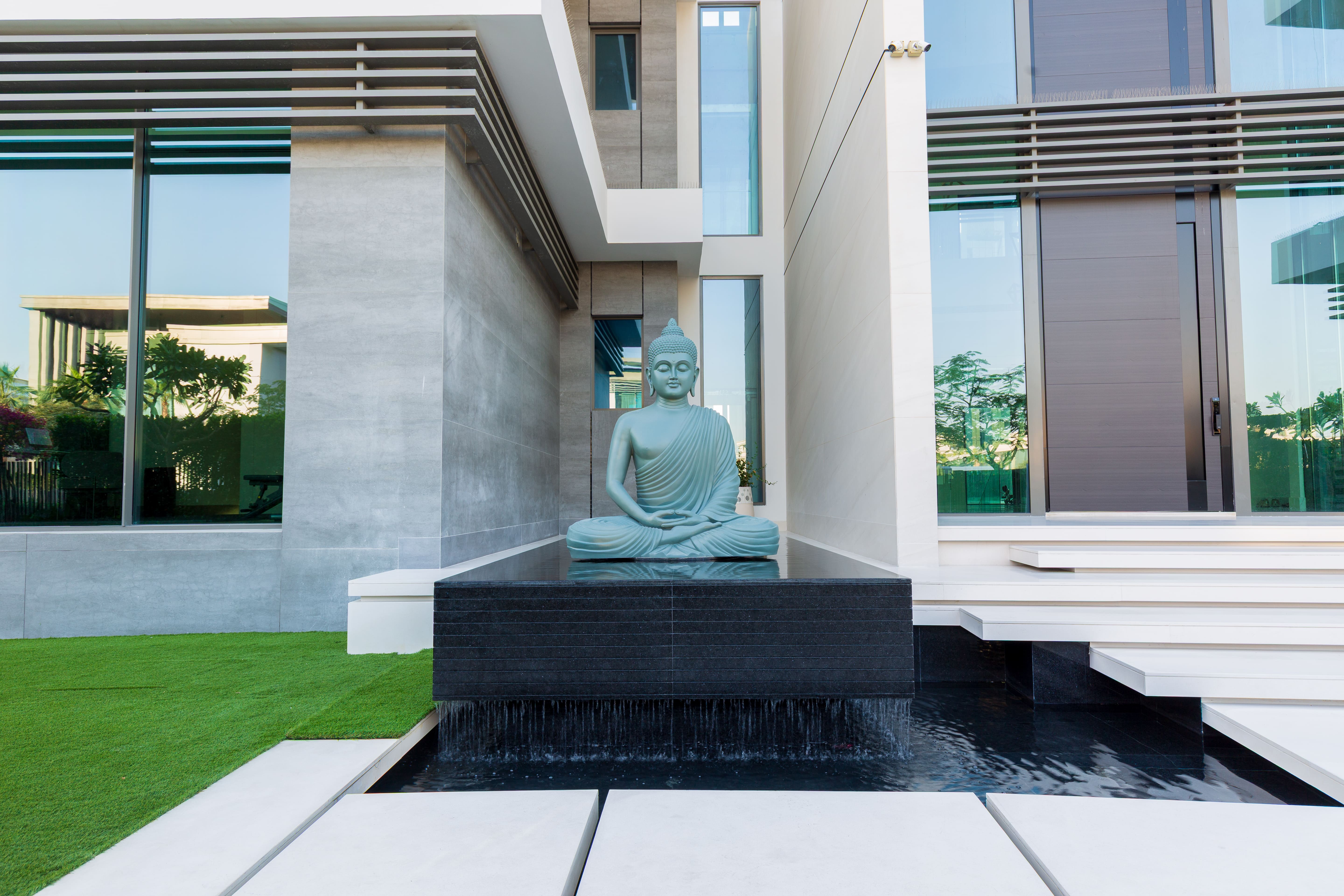 Buddha water feature within the villa landscape